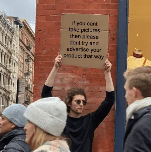 Protest sign meme: if you cant take pictures then please dont try and advertise your product that way