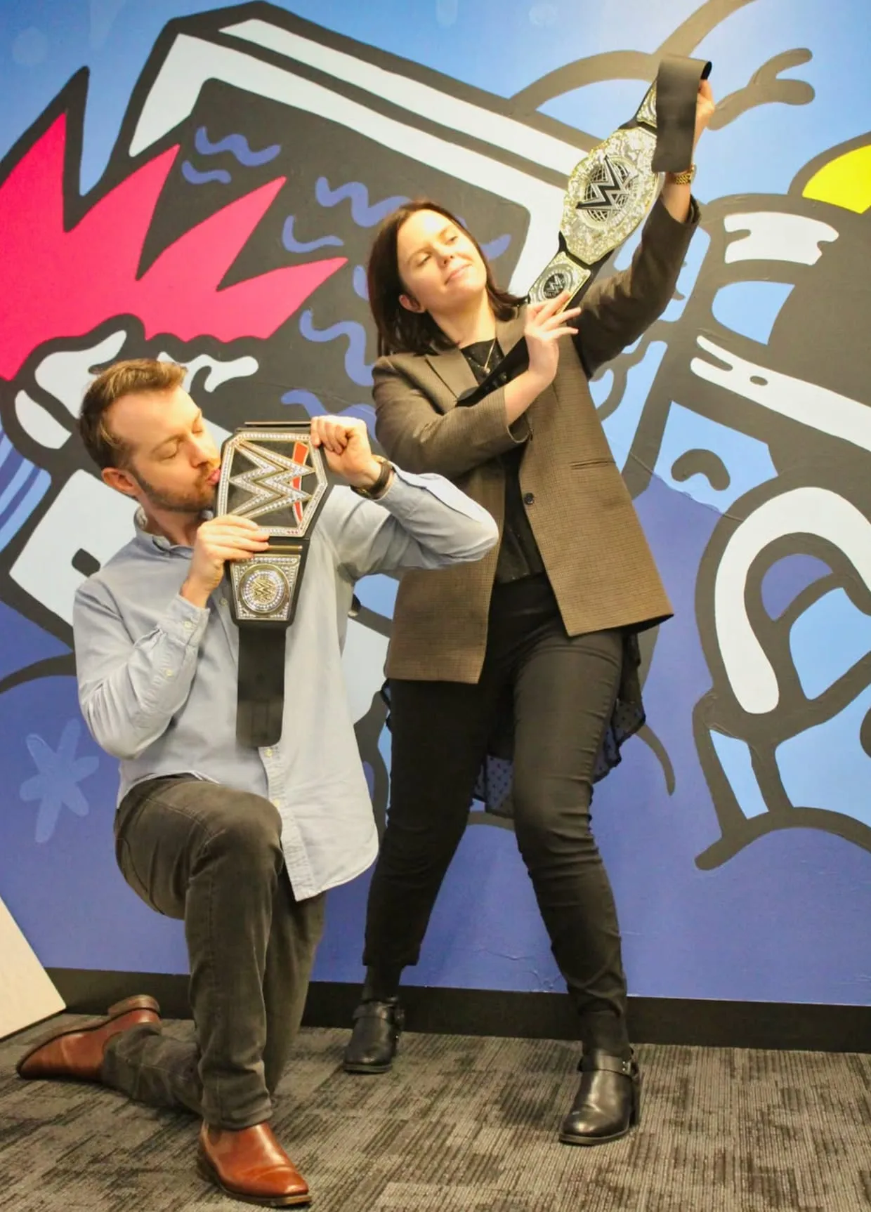 Two of the Local Digital SEO team celebrating with championship belts