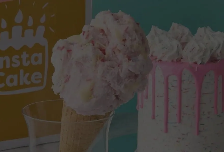 An ice cream cone and a pink drip cake from InstaCake
