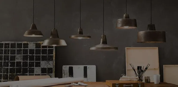 Pendant lights hanging over a workspace, from OzLighting
