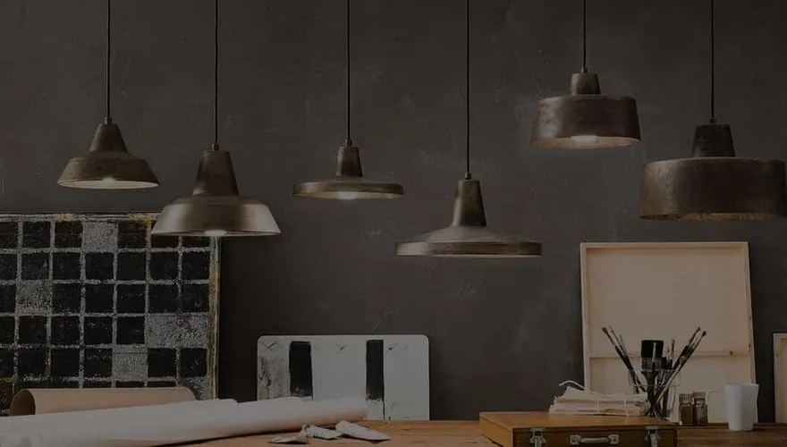 Pendant lights hanging over a workspace, from OzLighting