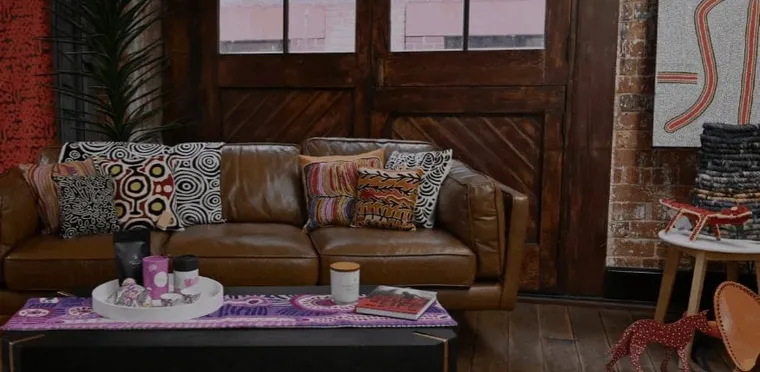 A living room styled with Aboriginal art and homewares from Welcome to Country