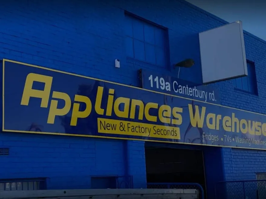 The blue Appliances Warehouse shopfront and street sign
