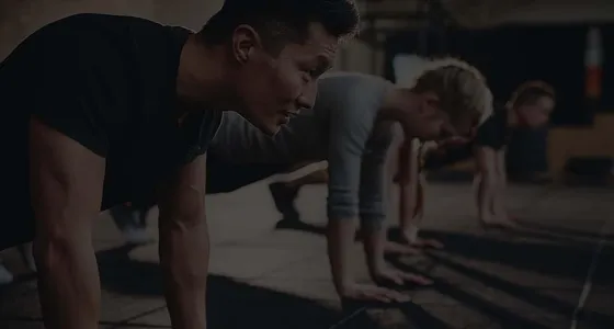 A group push-up session in the gym, from Fitness Muscle Meals