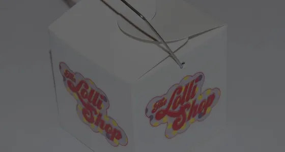 A branded takeaway lolly box from The Lolli Shop