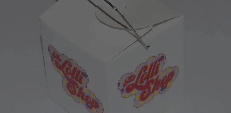 A branded takeaway lolly box from The Lolli Shop