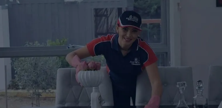 A Jim's Cleaning Melbourne cleaner working in a living room