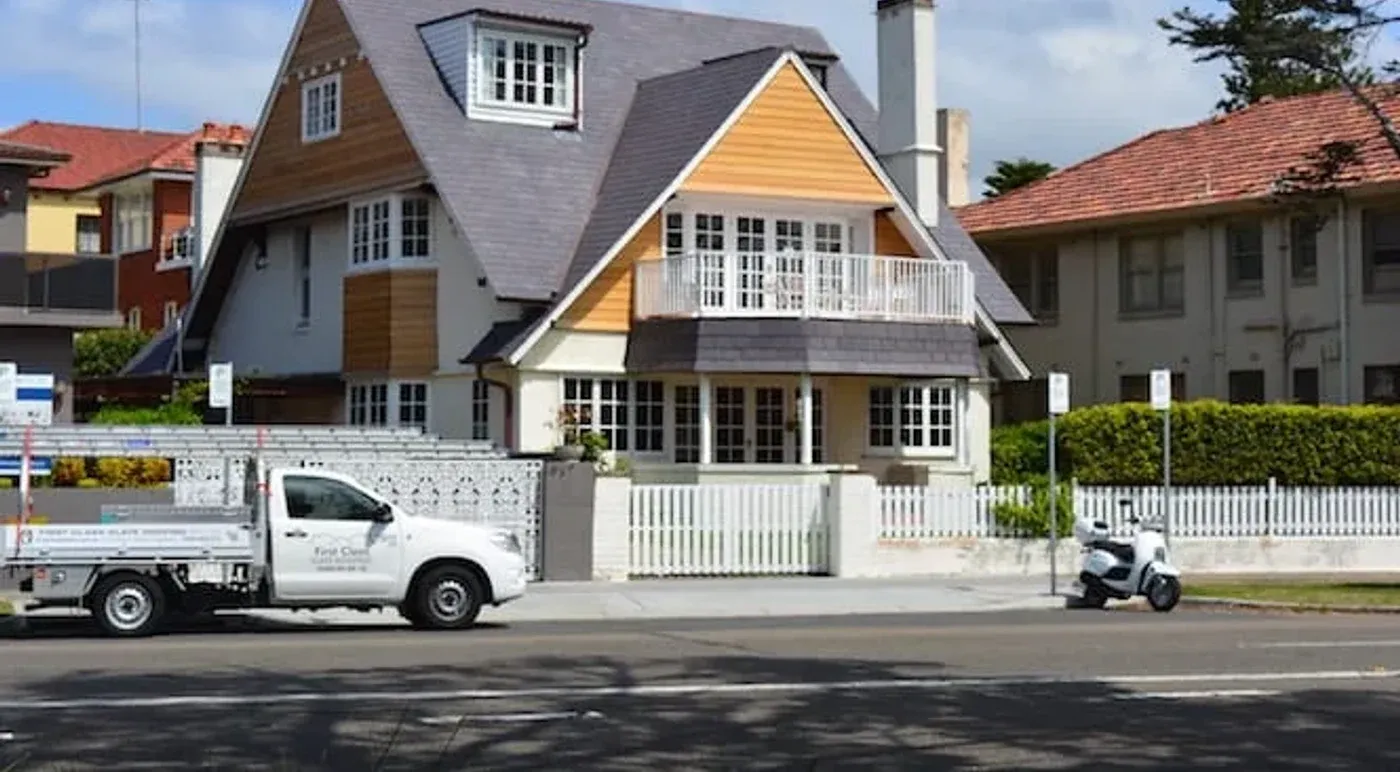 A slate roof by First Class Slate, with the company ute out front.